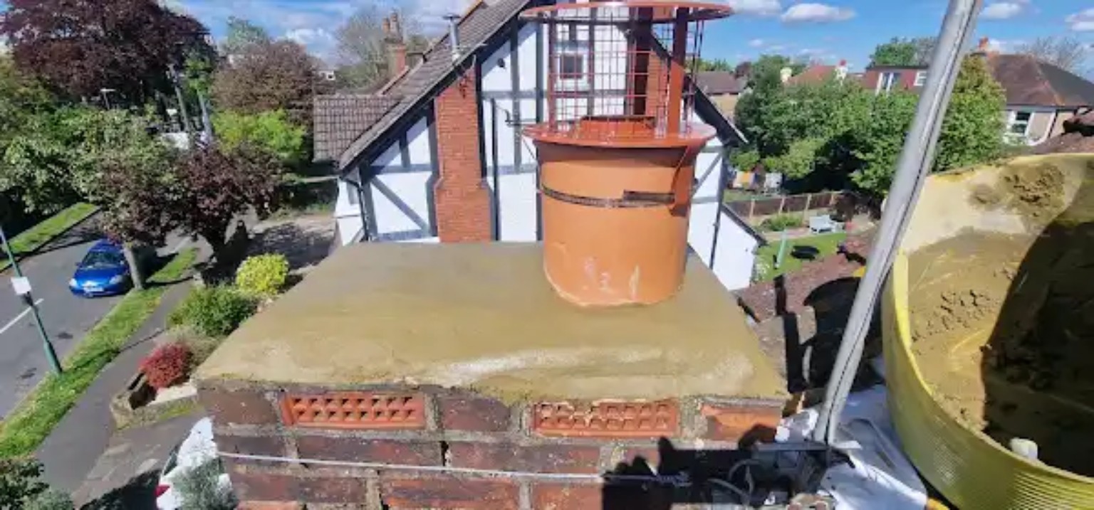 Completed chimney stack with new haunching, terracotta pot and fitted cowl